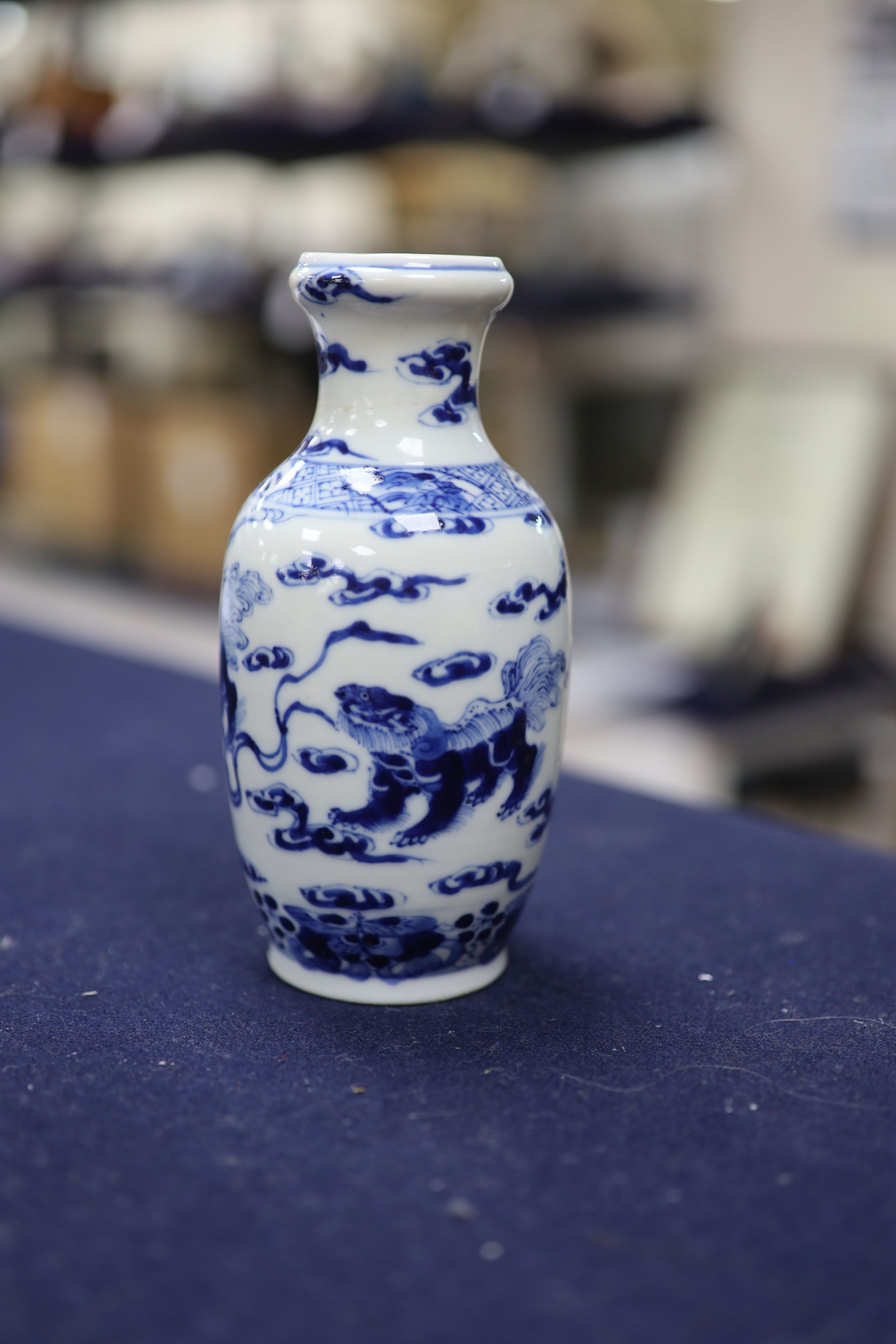 Two Chinese blue and white vases and a dish, together with a famille rose dish, tallest 28cm